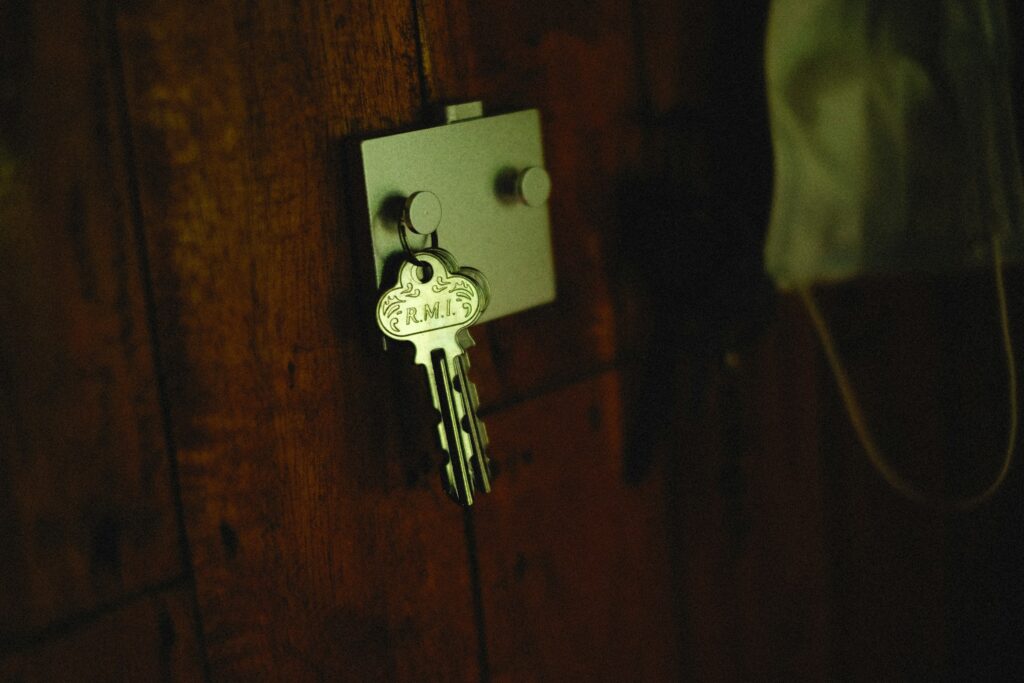 A key hanging on a wooden door