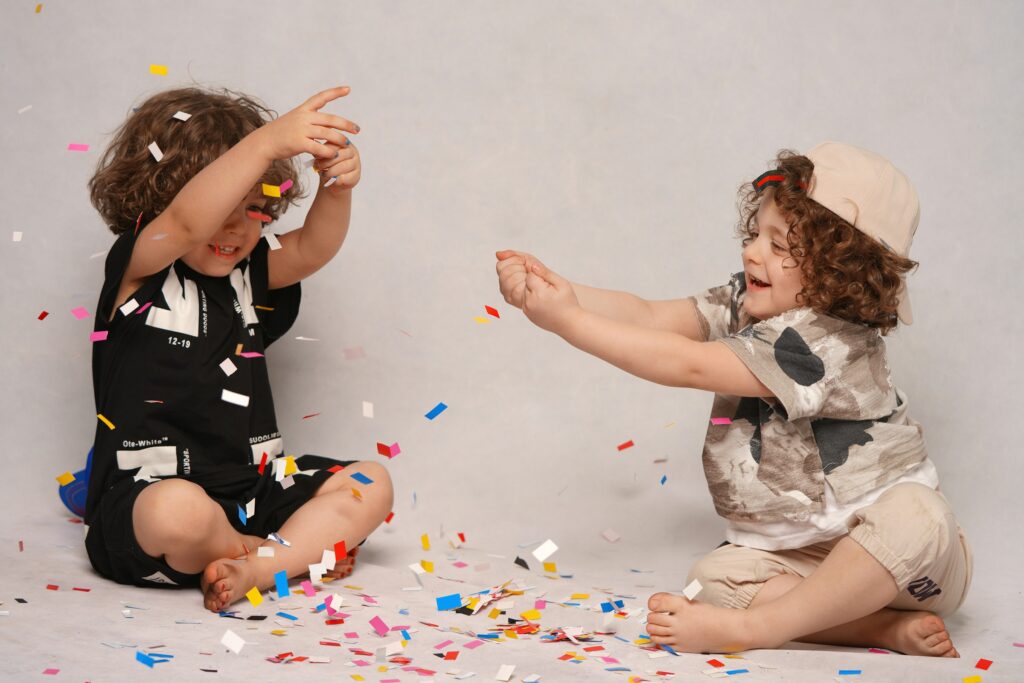 Two young girls playing together indoors, enjoying screen-free indoor activities for kids.