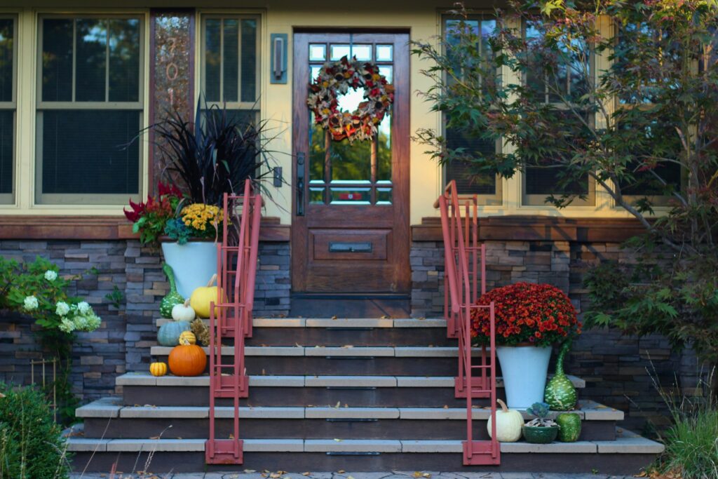 Inviting front porch with red chairs and simple railings