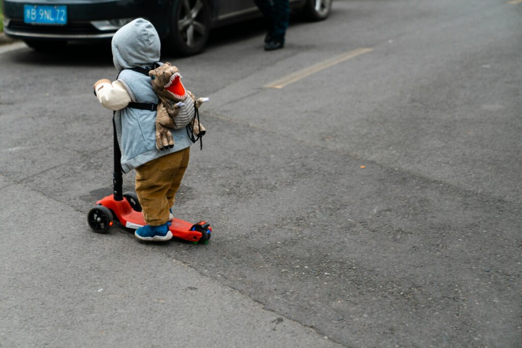 A kid on a scooter