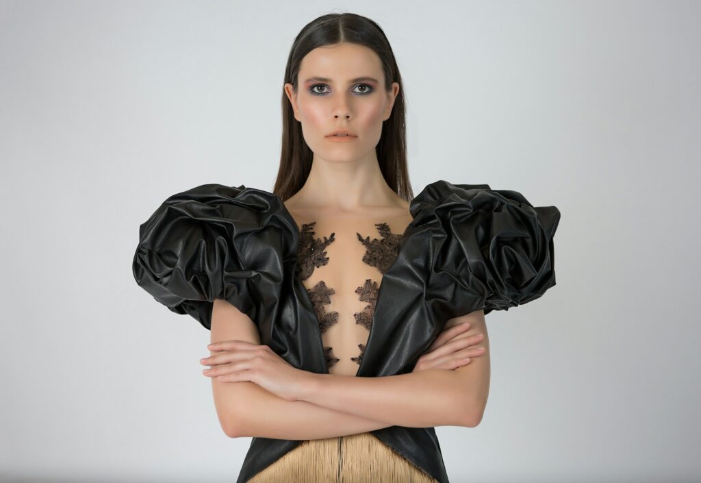 A woman wearing an elegant dress that is in fashion trends for 2025