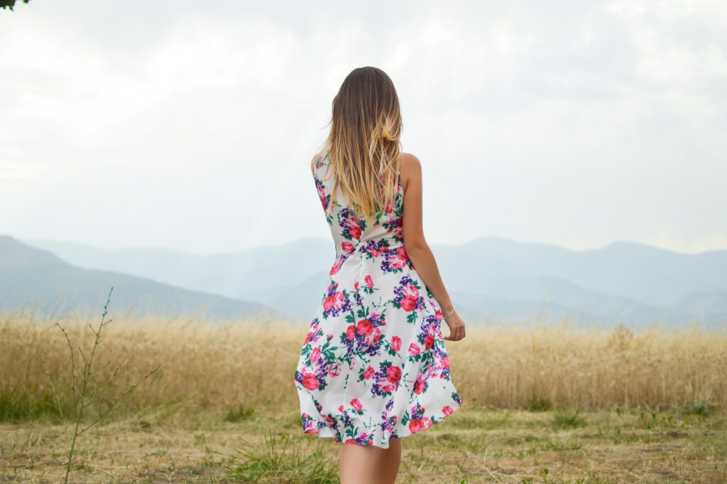A woman wearing corset floral dress
