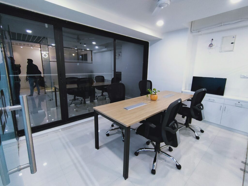 A private office featuring a table and chairs