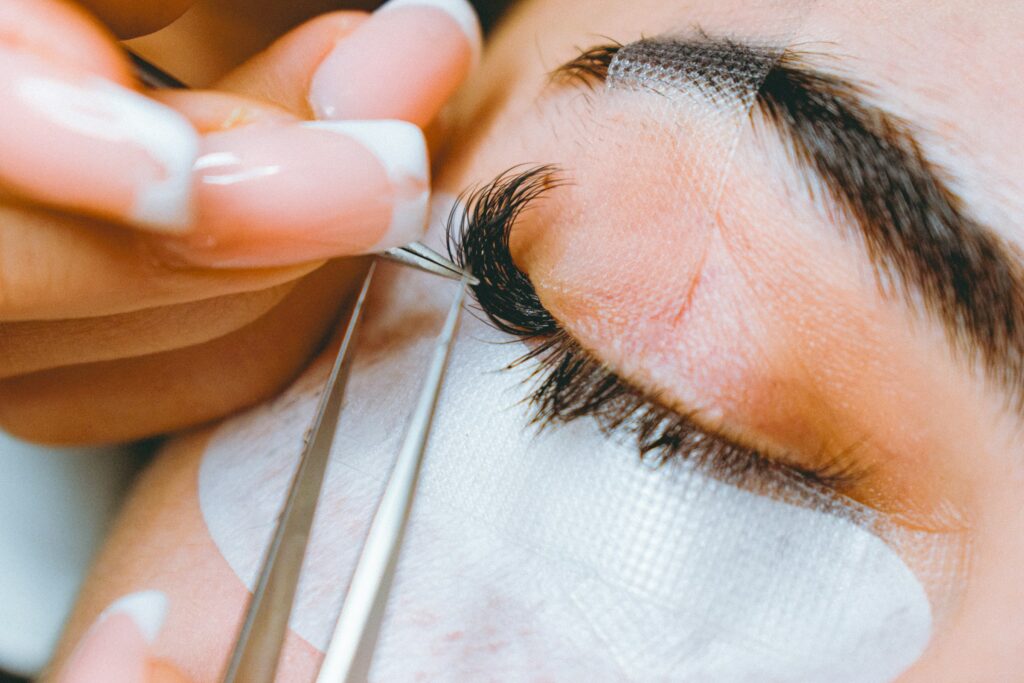 Close-up of a lash technician working around the eye area during a lash lift and tint treatment