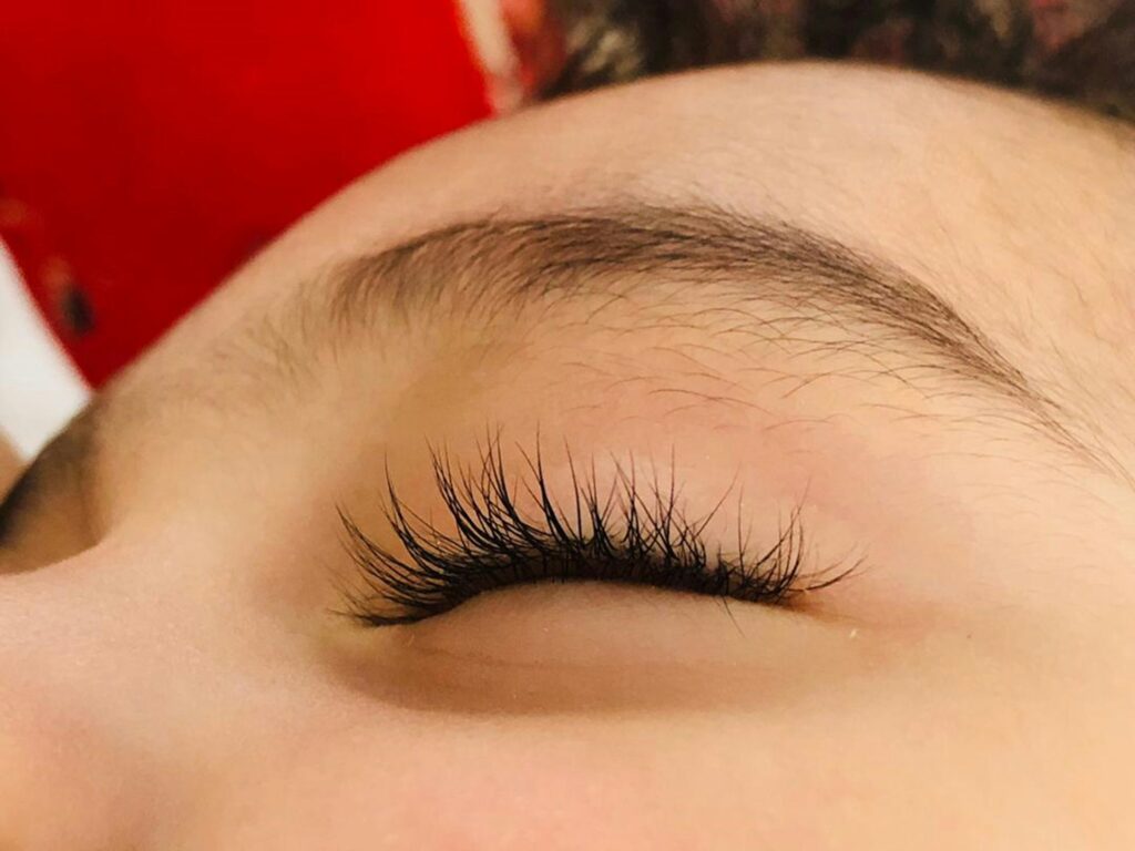 Close-up of long, natural-looking eyelashes after cils lifting treatment