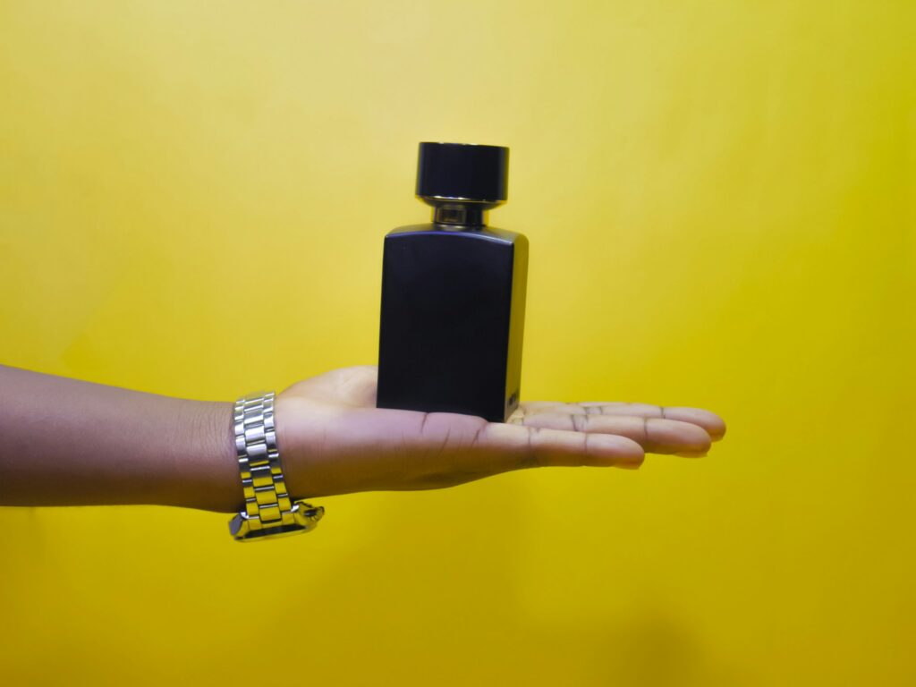 A man holding a black deodorant stick – the best deodorant for men seeking all-day freshness.