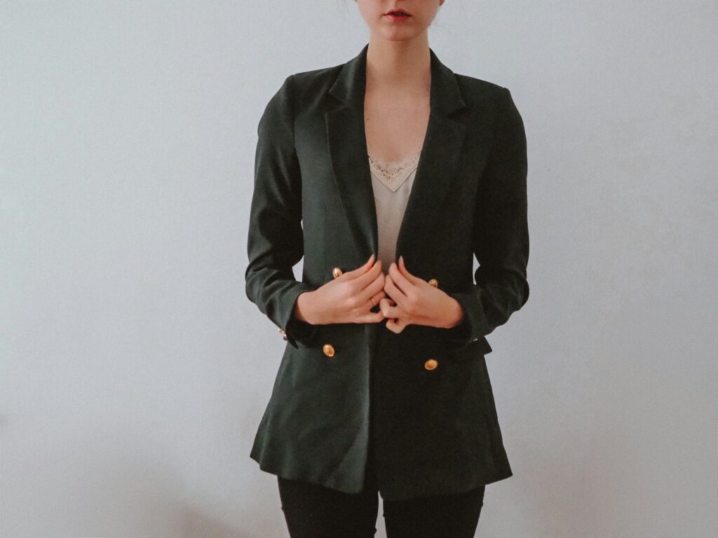 Woman wearing a black boxy blazer and skirt — a stylish example for those looking to shop boxy blazers