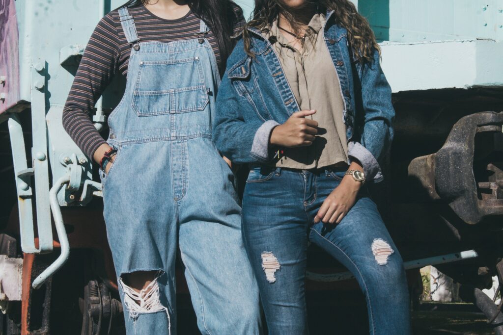 Two women in stylish denim standing side by side, a modern take on old money outfits with casual elegance.