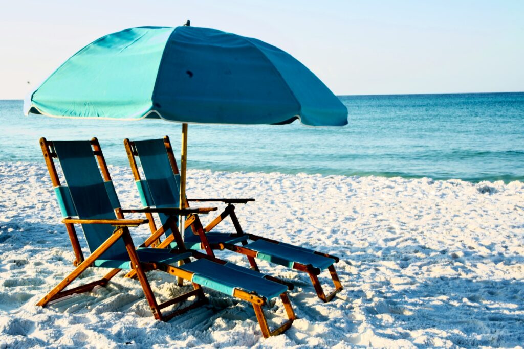 Beach chairs and umbrella on one of the best beaches in Florida Gulf Coast. 