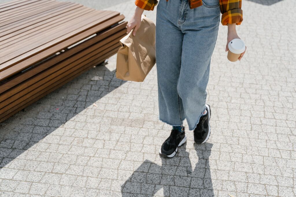 Cropped barrel jeans paired with sneakers for a relaxed, off-duty weekend outfit